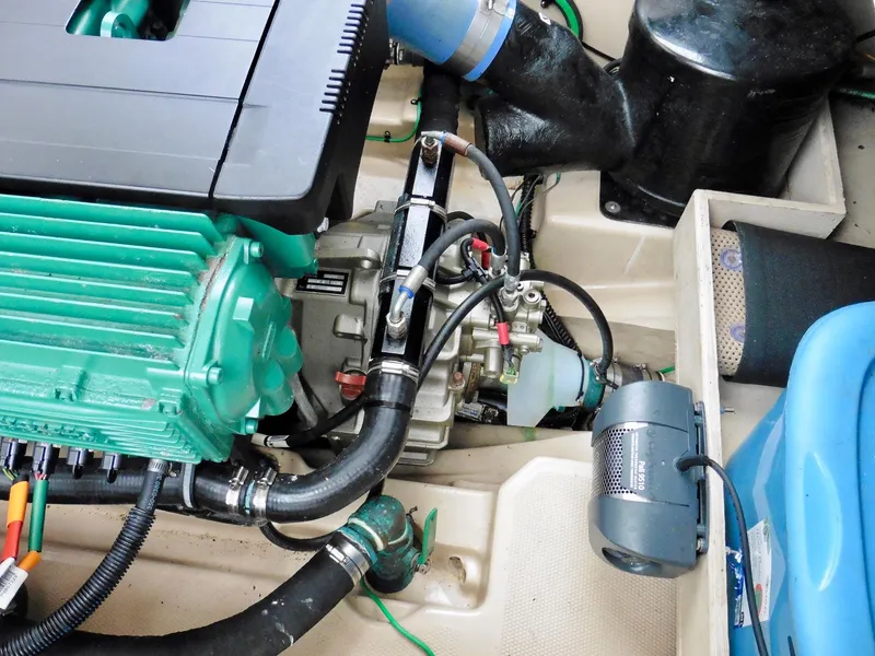 Slide: The Image of Engine compartment of a 2015 Cutwater 30CB boat, showcasing mechanical components. - 28