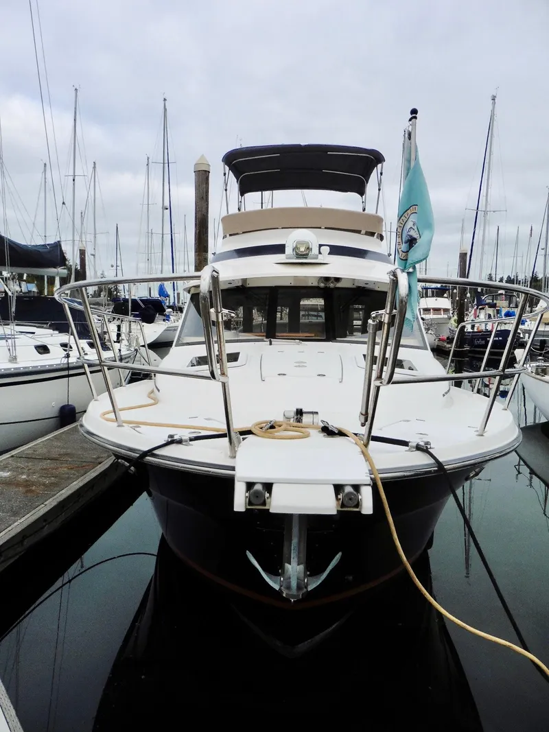 Slide: The Image of 2015 Cutwater 30CB yacht docked at marina, front view. - 3