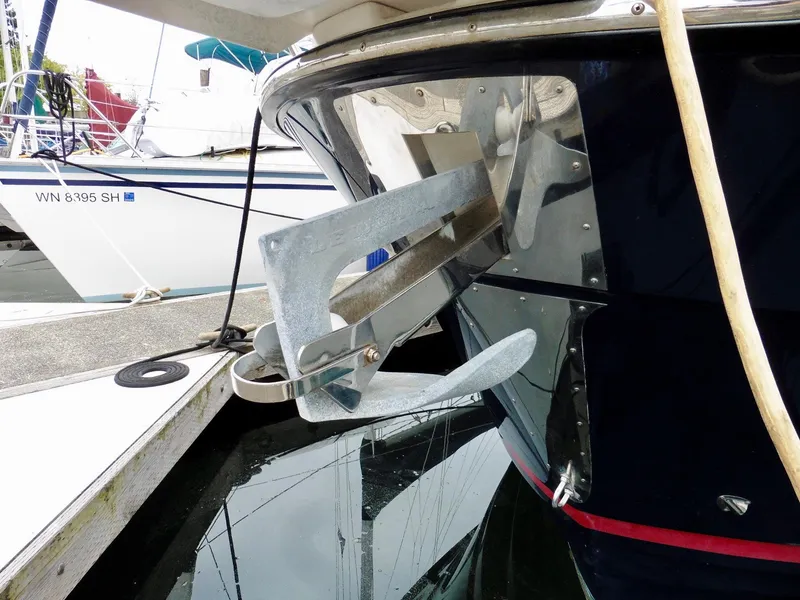 Slide: The Image of 2015 Cutwater 30CB boat with anchor at marina dock. - 4