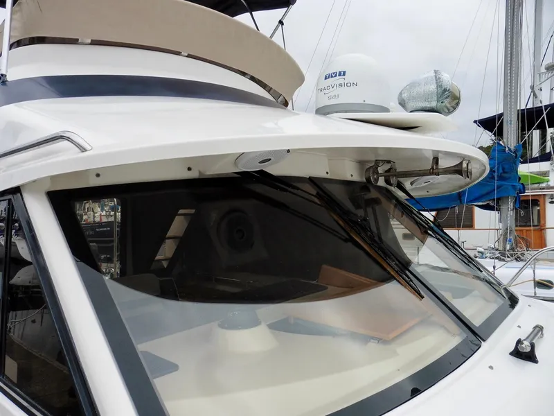 Slide: The Image of 2015 Cutwater 30CB boat with sleek design and modern navigation equipment. - 8