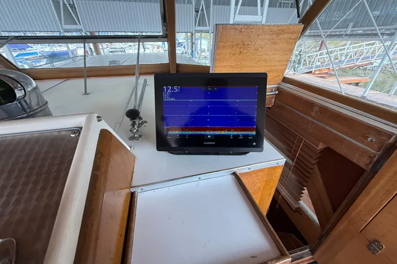 Slide: The Image of 1961 Chris-Craft 55 yacht interior with Garmin navigation display. - 26