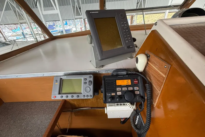 Slide: The Image of 1961 Chris-Craft 55 yacht dashboard with navigation and communication equipment. - 28