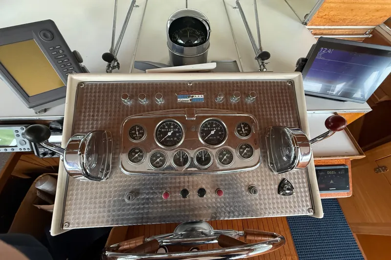 Slide: The Image of 1961 Chris-Craft 55 yacht dashboard with vintage gauges and controls. - 29