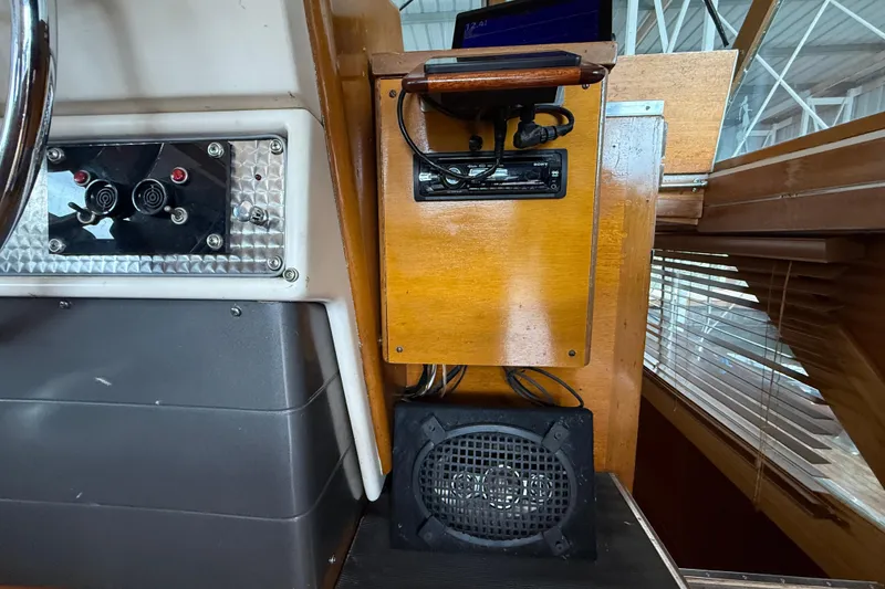 Slide: The Image of 1961 Chris-Craft 55 interior dashboard with vintage controls and audio equipment. - 32