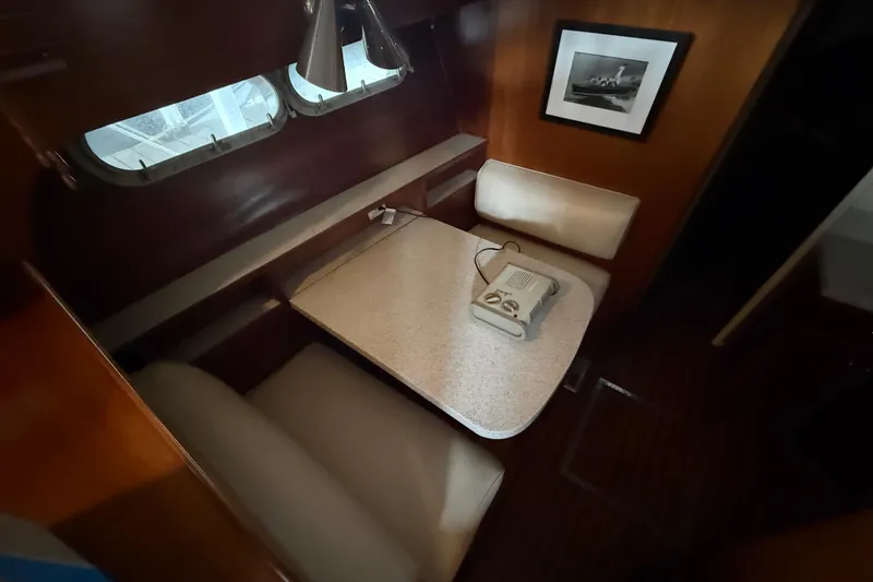 Slide: The Image of 1961 Chris-Craft 55 interior with vintage dining area and classic decor. - 39