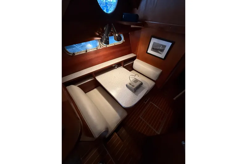 Slide: The Image of 1961 Chris-Craft 55 yacht interior with cozy dining area and vintage decor. - 41
