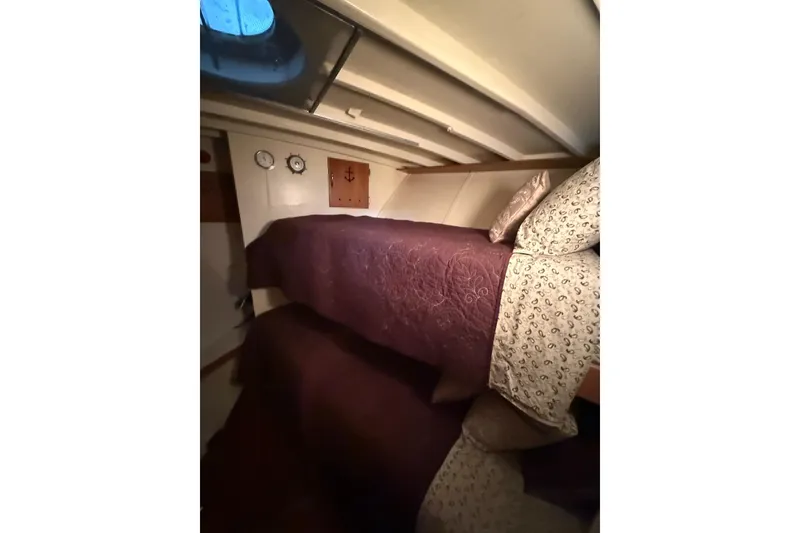 Slide: The Image of Interior cabin of 1961 Chris-Craft 55 yacht with cozy bunk beds and nautical decor. - 44