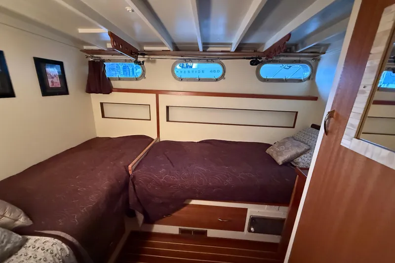 Slide: The Image of 1961 Chris-Craft 55 cabin interior with twin beds and nautical decor. - 48