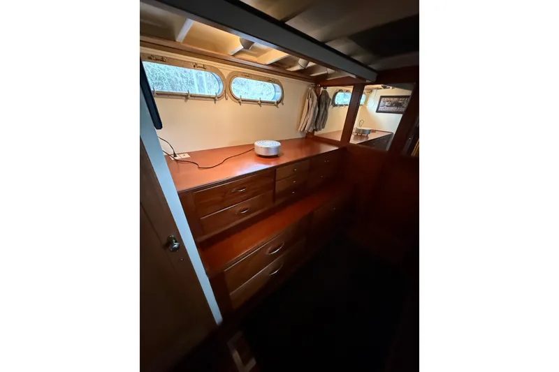 Slide: The Image of Interior of 1961 Chris-Craft 55 yacht with wooden cabinetry and porthole windows. - 50