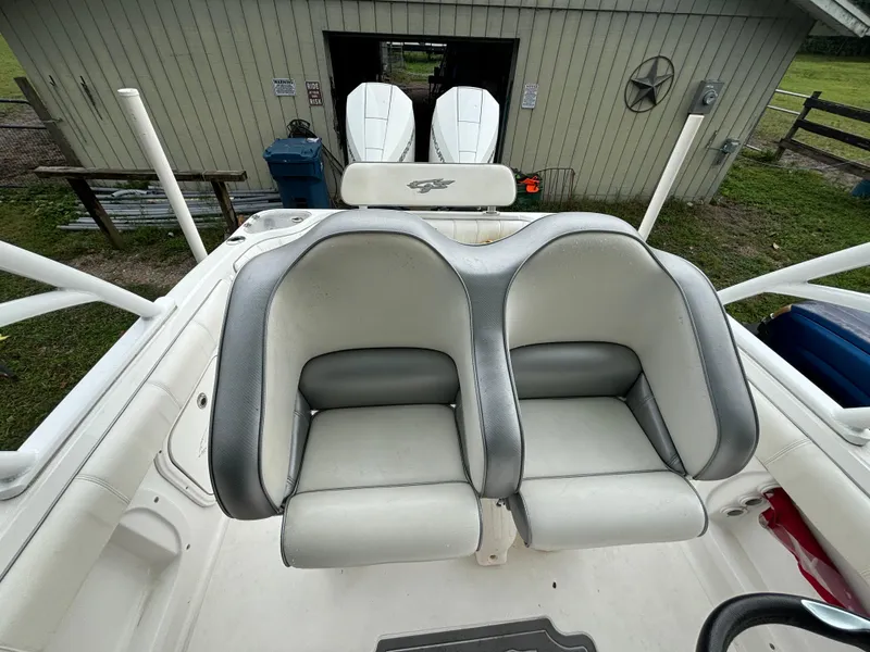 Slide: The Image of 2021 Glasstream 280 SCX boat seats with dual outboard motors in background. - 19