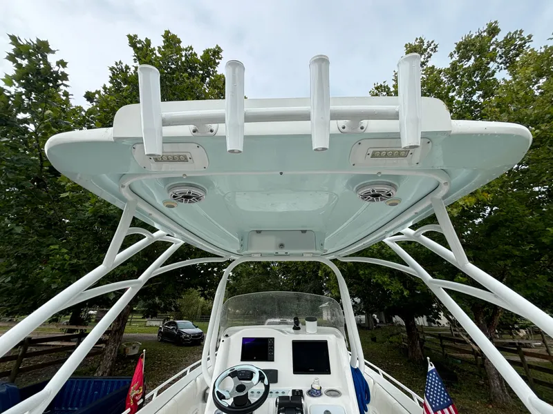 Slide: The Image of 2021 Glasstream 280 SCX boat helm with T-top and rod holders. - 20