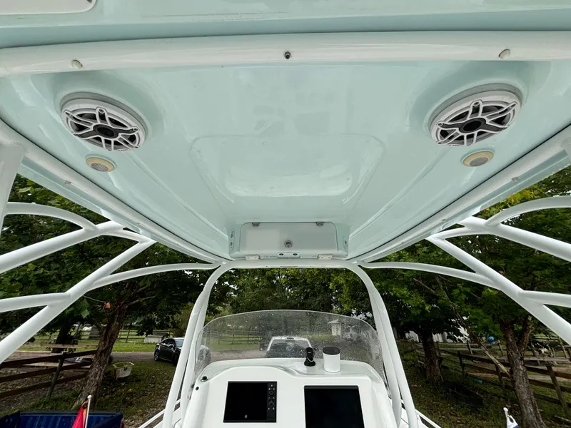 Slide: The Image of 2021 Glasstream 280 SCX boat interior with speakers and control panel. - 21