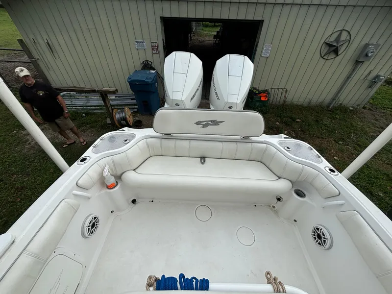 Slide: The Image of 2021 Glasstream 280 SCX boat with dual engines, spacious seating, and outdoor setting. - 24