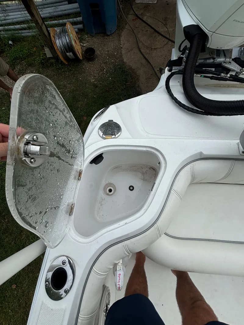 Slide: The Image of 2021 Glasstream 280 SCX boat interior with open storage compartment. - 27