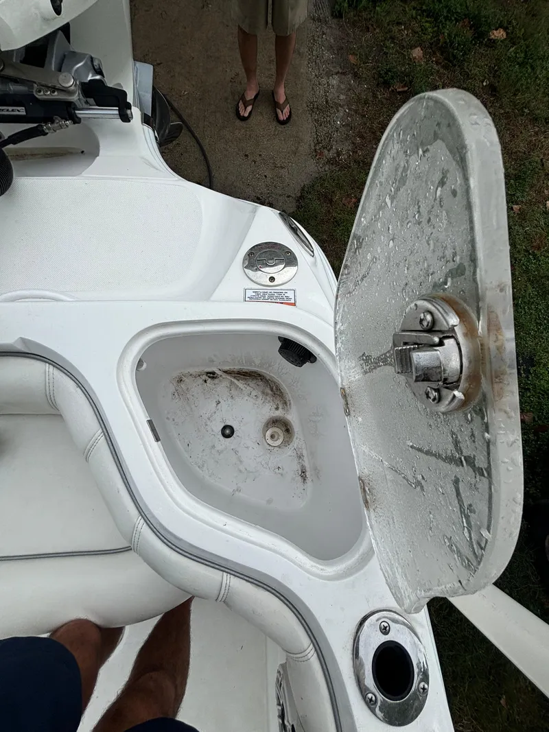 Slide: The Image of 2021 Glasstream 280 SCX boat with open storage compartment and cup holder. - 28