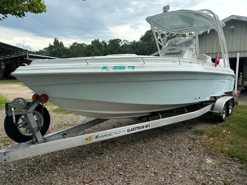 Slide: The Image of 2021 Glasstream 280 SCX boat on trailer, parked outdoors. - 3