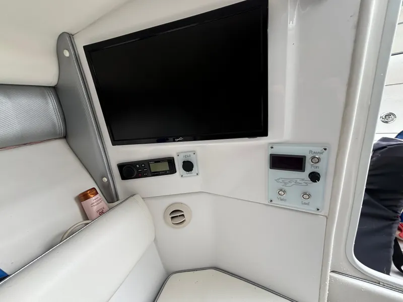 Slide: The Image of Interior of 2021 Glasstream 280 SCX boat with control panel and screen. - 32