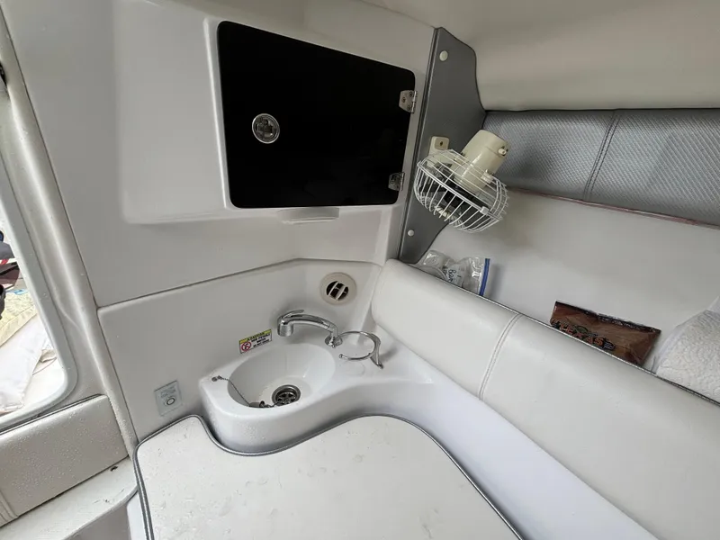 Slide: The Image of 2021 Glasstream 280 SCX cabin interior with sink and storage. - 33