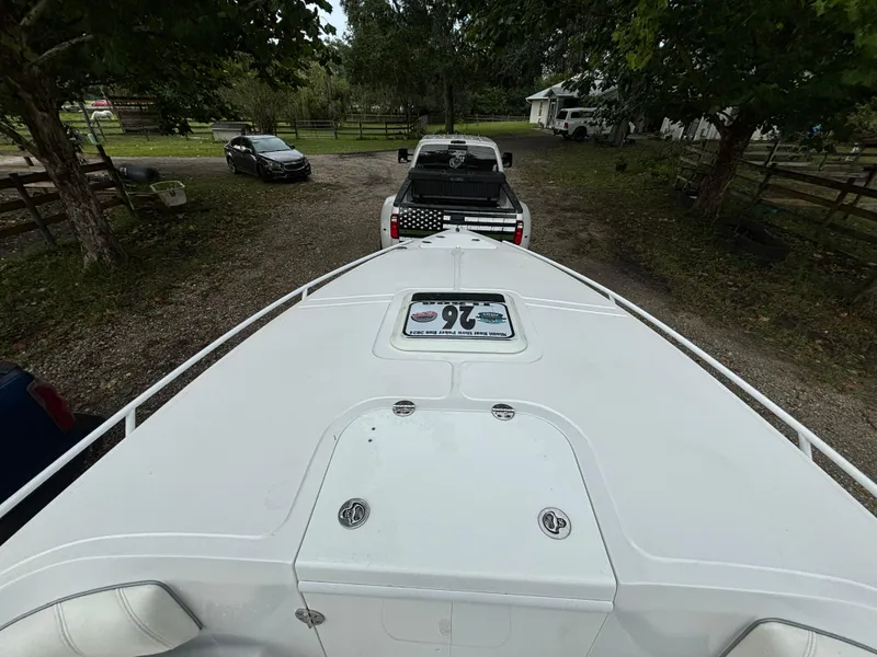 Slide: The Image of 2021 Glasstream 280 SCX boat on trailer, parked in a rural setting. - 7