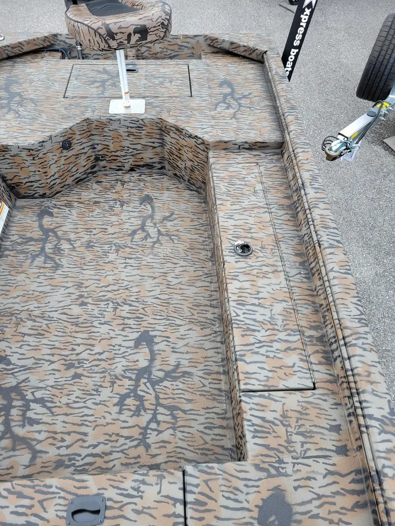 Slide: The Image of Camouflage interior of 2026 Xpress HD16DB duck hunting boat, featuring a Yamaha 40 hp engine. - 12