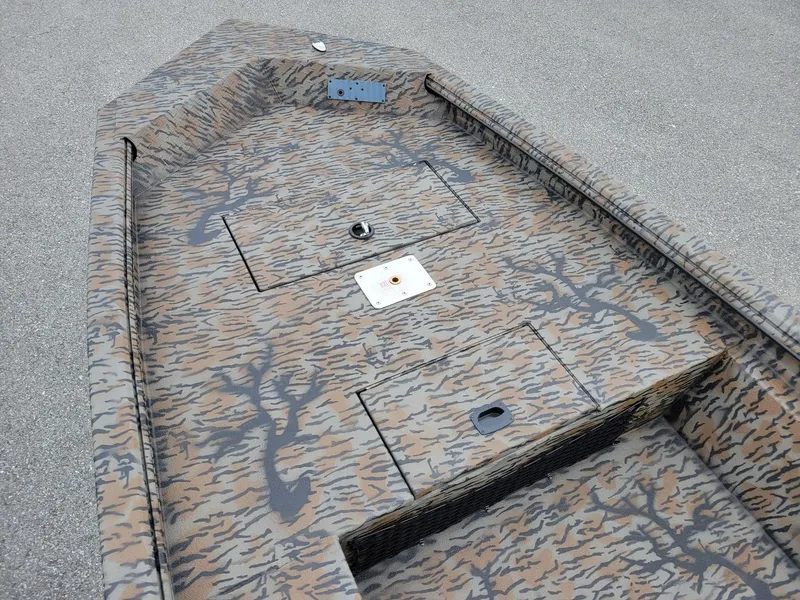 Slide: The Image of 2026 Xpress HD16DB duck hunting boat with camouflage interior design. - 4