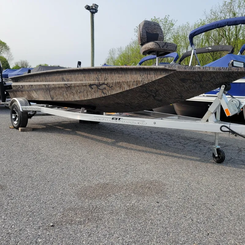 Slide: The Image of 2025 Xpress H18DB Duck Boat with Yamaha 70 hp engine on trailer. - 4
