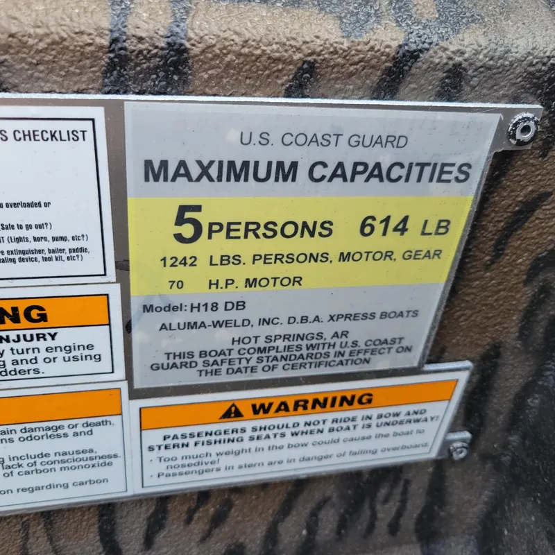 Slide: The Image of 2025 Xpress H18DB Duck Boat capacity label, 5 persons, 614 lbs, 70 HP motor. - 9