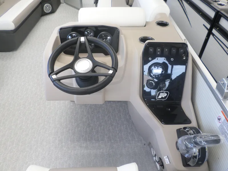 Slide: The Image of 2024 Princecraft Vectra 23 L boat dashboard with steering wheel and controls. - 5