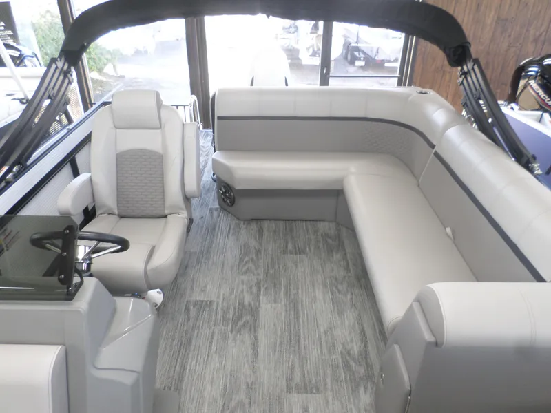 Slide: The Image of 2025 Apex Qwest 8522 Lanai boat interior with modern seating and sleek design. - 4