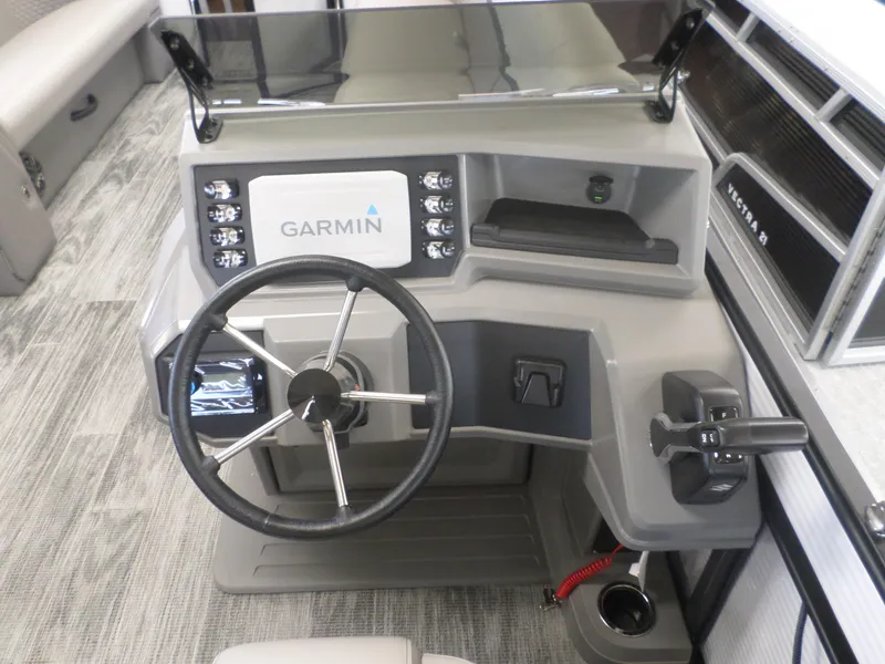 Slide: The Image of 2025 Apex Qwest 8522 Lanai boat dashboard with Garmin navigation system and steering wheel. - 5