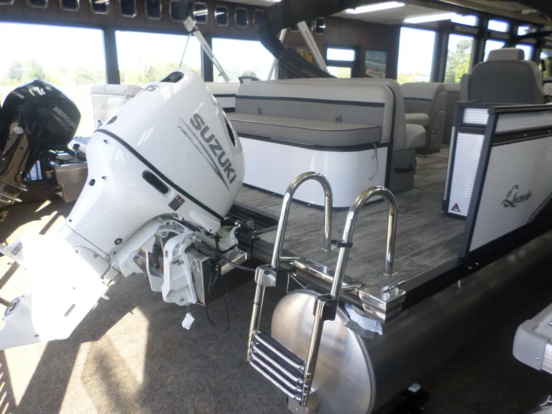 Slide: The Image of 2025 Apex Qwest 8522 Lanai pontoon boat with Suzuki outboard motor. - 6