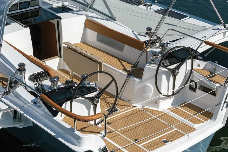 Slide: The Image of Luxury Dragonfly 36 sailboat cockpit with dual steering wheels, teak decking, and modern controls, 2026 model. - 5