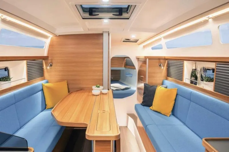 Slide: The Image of Modern Dragonfly 36 yacht interior, 2027 model, featuring cozy seating and elegant wood finishes. - 8