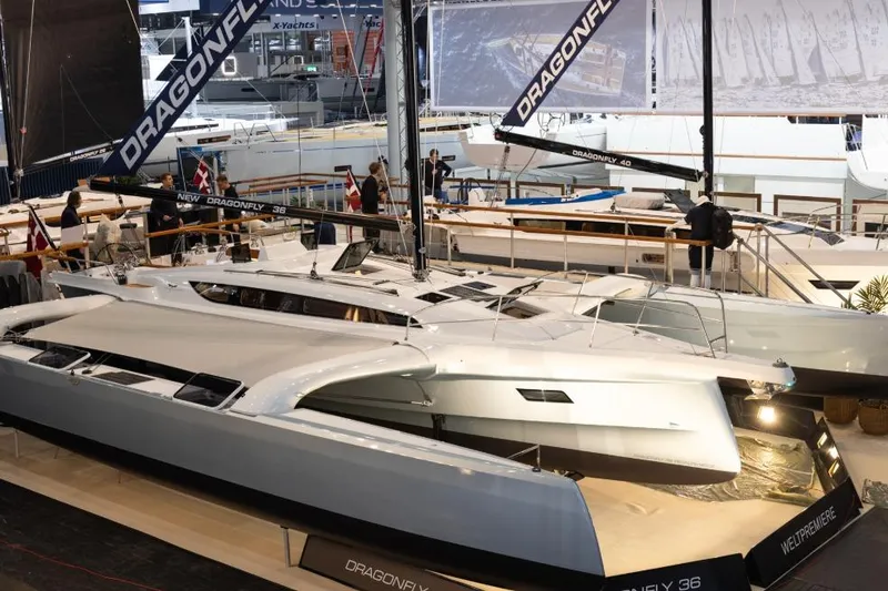 The Image of 2027 Dragonfly 36 yacht showcased at a boat exhibition, featuring sleek design and modern sails. - 0