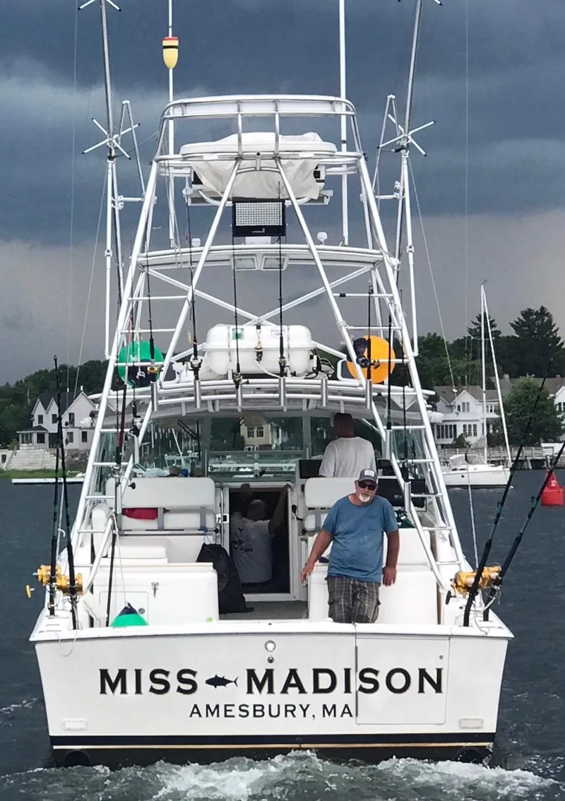 Slide: The Image of 2003 Cabo Express boat "Miss Madison" in Amesbury, MA, with fishing gear and passengers. - 3