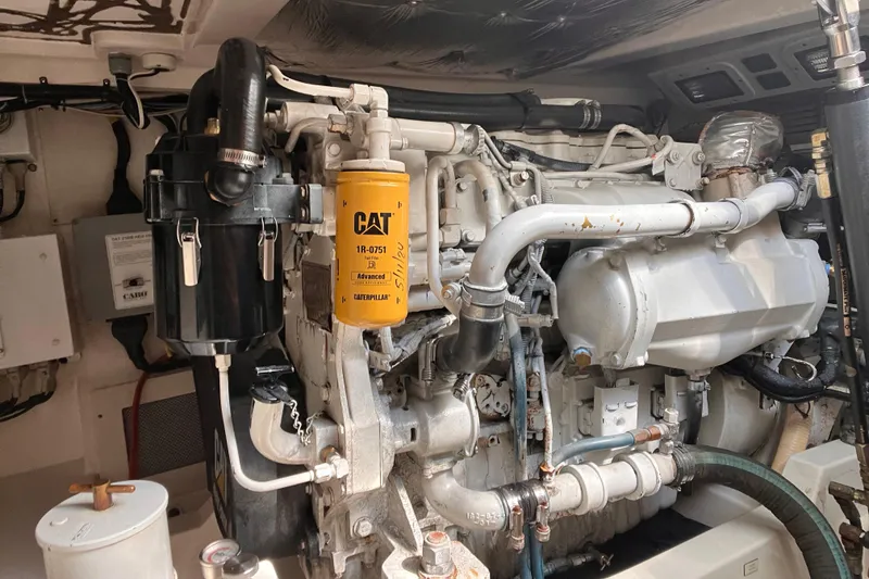 Slide: The Image of Engine room of a 2003 Cabo Express boat featuring a CAT engine. - 33