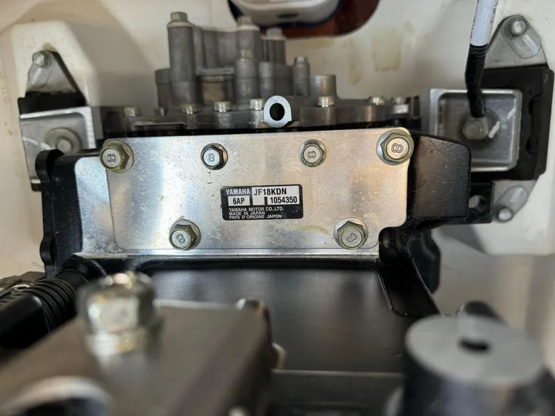 Slide: The Image of Close-up of a 2021 Yamaha AR190 engine component with serial number plate. - 11
