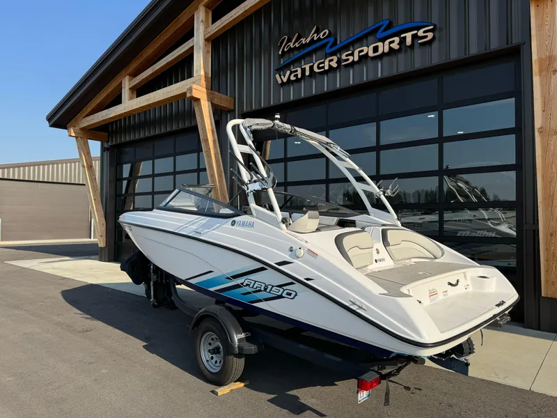 Slide: The Image of 2021 Yamaha AR190 boat at Idaho Water Sports dealership, showcasing sleek design and modern features. - 4