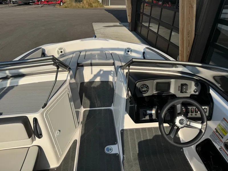 Slide: The Image of 2021 Yamaha Boats AR190 interior with steering wheel and dashboard controls. - 7