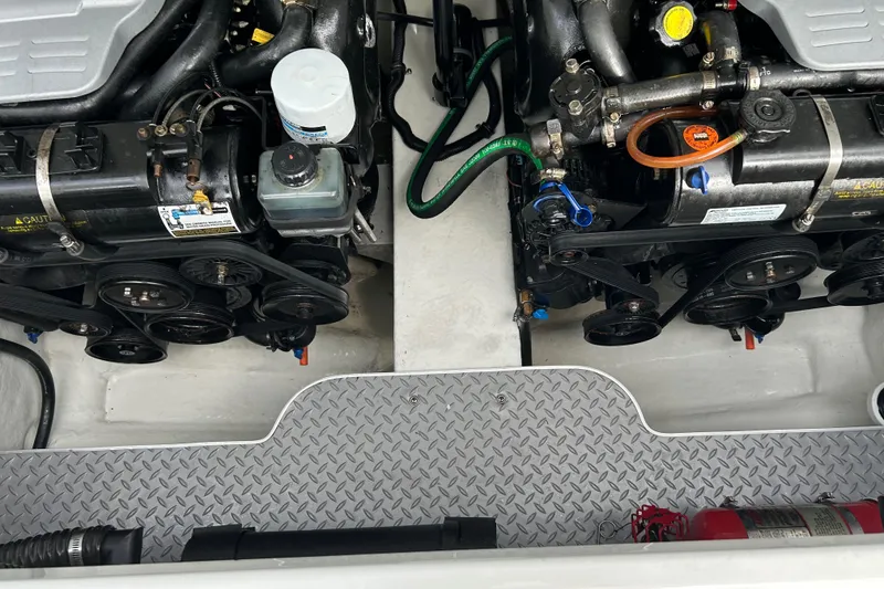 Slide: The Image of Engine compartment of a 2015 Formula 290 Bowrider boat, featuring dual engines and a fire extinguisher. - 22