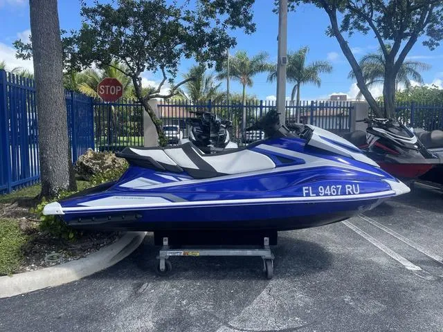 Slide: The Image of 2018 Yamaha WaveRunner GP1800, blue and white, parked outdoors. - 1