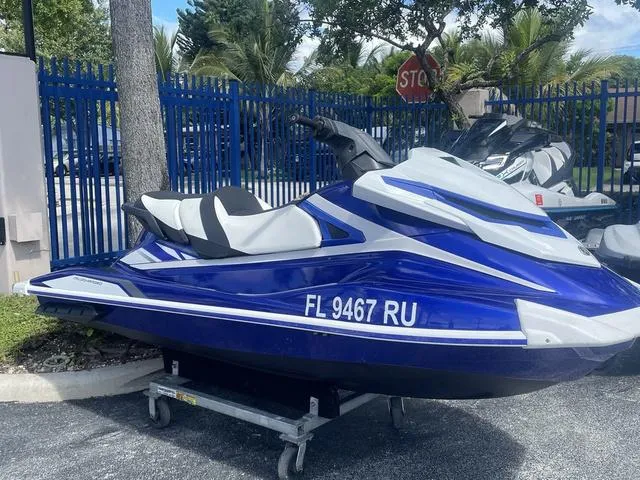 Slide: The Image of 2018 Yamaha WaveRunner GP1800 in blue, parked outdoors on a trailer. - 6