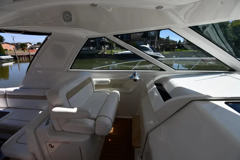 Slide: The Image of Interior view of 2010 Sea Ray 450 Sundancer yacht with seating and windows. - 20
