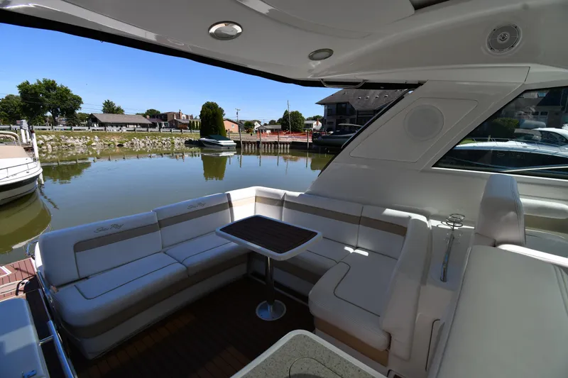 Slide: The Image of Luxurious 2010 Sea Ray 450 Sundancer yacht interior with spacious seating and waterfront view. - 26