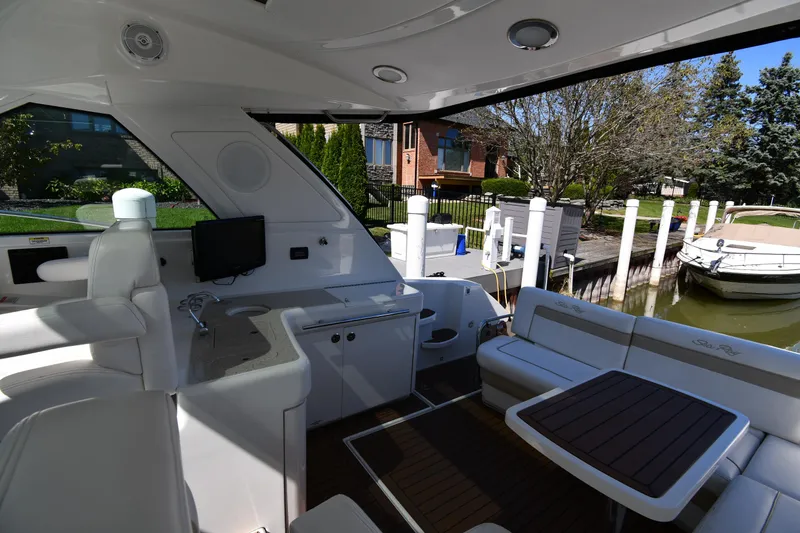 Slide: The Image of Interior of 2010 Sea Ray 450 Sundancer yacht with seating and dock view. - 27
