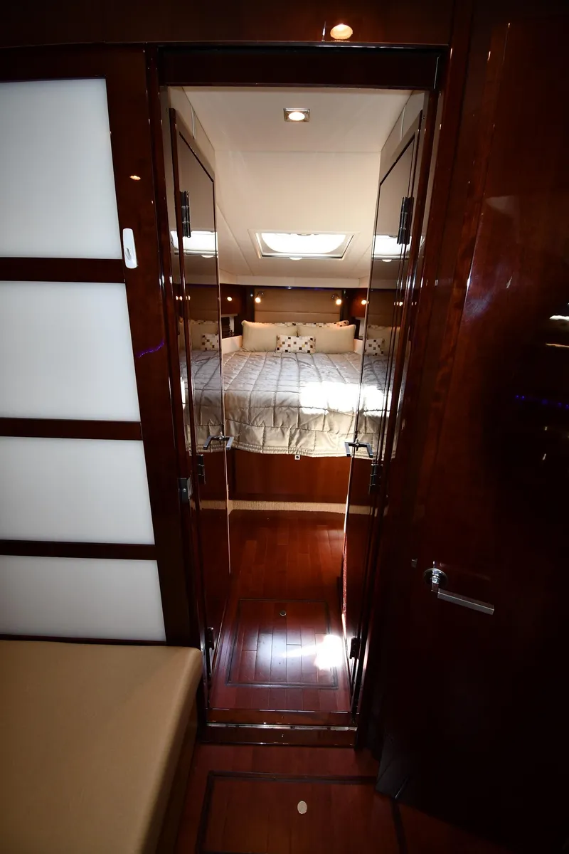 Slide: The Image of Luxurious cabin interior of 2010 Sea Ray 450 Sundancer yacht with elegant wood finishes. - 33