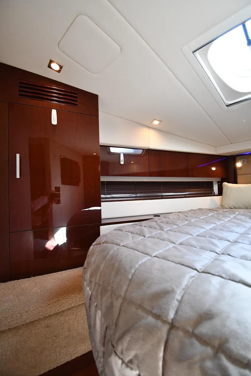 Slide: The Image of Luxurious interior of 2010 Sea Ray 450 Sundancer yacht with elegant wood finishes. - 36