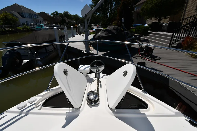 Slide: The Image of Bow view of 2010 Sea Ray 450 Sundancer docked at marina. - 5