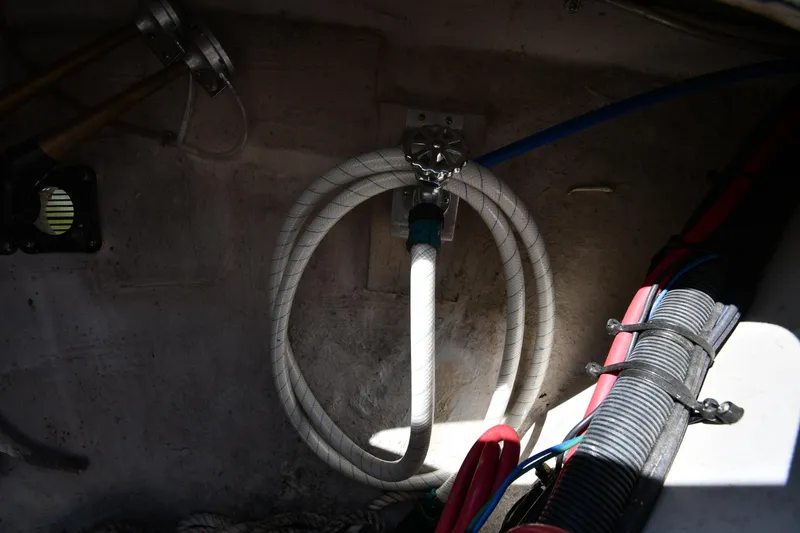 Slide: The Image of Engine compartment of 2010 Sea Ray 450 Sundancer with hoses and wiring. - 6