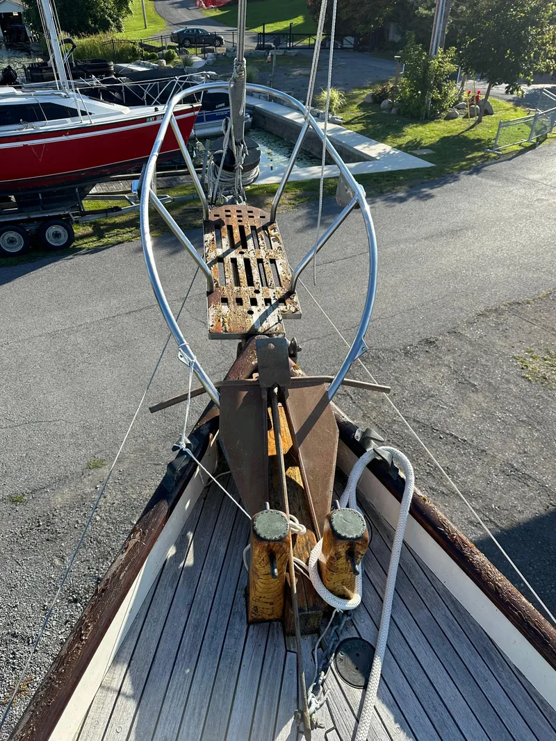 Slide: The Image of 1972 Mariner 31 Ketch bow view, showcasing deck and rigging details. - 14